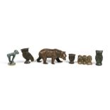 A cast bronze bear, 9cms (3.5ins) long; together with a group of bronze monkey and owl figures.