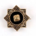 A Victorian yellow metal memorial brooch, 3cms (1.1ins) diameter.