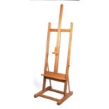 A large modern beech Mabef easel, 155cms (61ins) high.