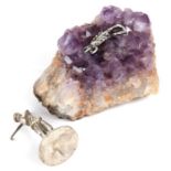 An amethyst geode mounted with a silver scorpion; together with a silver plated golfing figure.