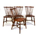 A set of four elm comb back dining chairs on turned supports with crinoline stretchers (4).