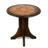 A Victorian walnut occasional table, the circular top inlaid with stylised flowers and George &