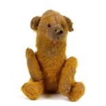 An early jointed plush miniature teddy bear, 14cms (5.5ins) high.