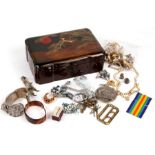 A Japanese lacquer jewellery box containing a quantity of costume jewellery and vintage cuff links.