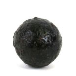 An 18th/19th century cast iron 2.5lb (approximately) round shot cannon ball. Approximate diameter