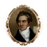 A yellow metal mounted reverse painted portrait miniature brooch depicting a young gentleman,