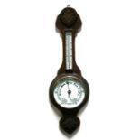 A late 19th / early 20th century oak cased barometer thermometer.