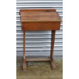 A vintage oak school desk, 58cms (23ins) wide.