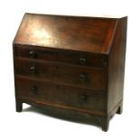 A 19th century mahogany bureau with three long graduated drawers, on bracket feet, 105cms (41.