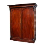 A Victorian mahogany two door wardrobe with three internal linen drawers, two short and one long