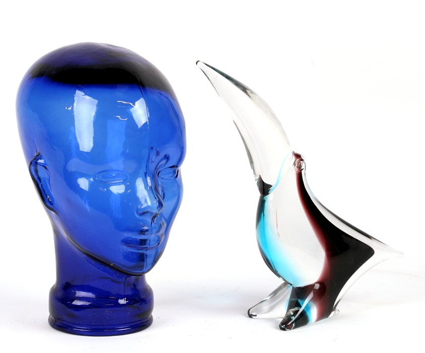 A Murano style art glass toucan, 28cms (11ins) high; together with a blue glass model of a head,