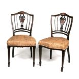 A pair of Edwardian Sheraton style inlaid mahogany chairs.