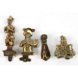 A group of novelty brass door knockers, the largest 13cms (5ins) high.