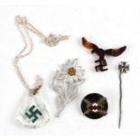 A quantity of German Nazi badges including a shooting enamel badge.