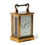 A Mappin & Webb brass cased carriage timepiece, the white enamel dial with Roman numerals, 11cms (