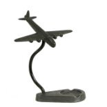 A WW2 aluminium four engined diving Bomber Aircraft standing on its ashtray base. Wingspan 16cms (