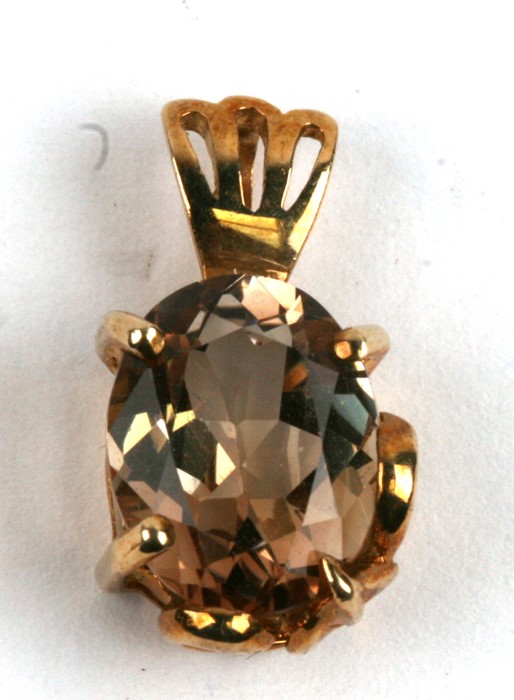 A 9ct gold citrine pendant.