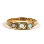 An 18ct gold opal and diamond ring, approx UK size 'M'.