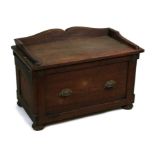 An unusual Campaign style teak chest with lift-up seat / lid and single drawer, 84cms (33ins) wide.