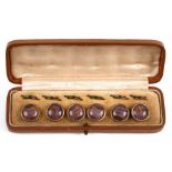 A cased set of six butterfly wing buttons.