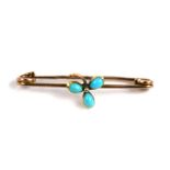 An Edwardian yellow metal turquoise bar brooch.