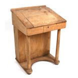A Victorian pine clerk's desk on turned front supports, 68cms (26.75ins) wide.
