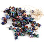 A quantity of loose Italian millifiori glass beads, the largest 3cms long.