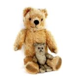 A Pedigree plush jointed teddy bear, 35cms (13.75ins) high; together with a smaller teddy bear,