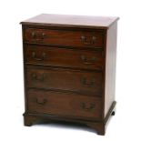 A mahogany chest of four long graduated drawers, on bracket feet, 64cms (25.25ins) wide.