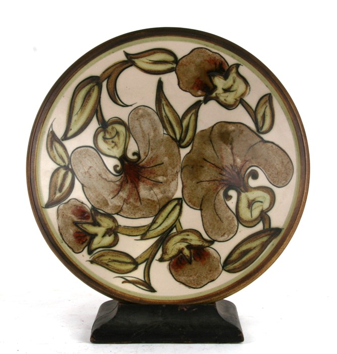 A large Denby Pottery fruit bowl painted with flowers and leaves, with artist's initials 'EP' to the