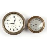 Two vintage eight-day car clocks, the largest 8.5cms (3.25ins) diameter