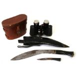 A pair of 8x30 field glasses in a leather case; together with a horn handled kukri (2).