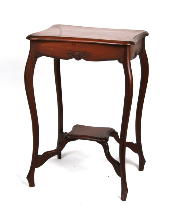 An Edwardian mahogany two-tier occasional table, 51cms (20ins) wide.