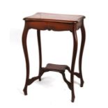 An Edwardian mahogany two-tier occasional table, 51cms (20ins) wide.