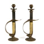 A pair of Royal Air Force sword hilt candlesticks. Overall height 30cms (11.75ins)
