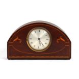 An Edwardian inlaid mahogany mantle clock, the silver dial with Roman numerals, 25cms (9.75ins)