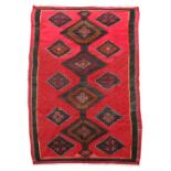 A red Persian Azerbaijan kilim runner, 343 by 145cms (135 by 57ins).