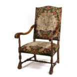 A 19th century walnut throne chair with acanthus capped arms, on turned supports with claw feet