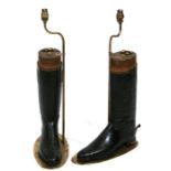 A pair of leather riding boots with wooden stretchers converted to table lamps, 64cms (25ins) high.