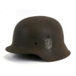 An M1942 SS German combat helmet shell. Makers mark to inside HPK 64 with a production number of