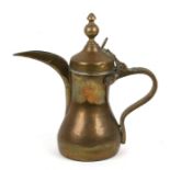 A Turkish / Islamic Dallah copper & brass coffee pot, 25cms (9.75ins) high.