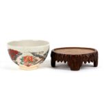 A Japanese Satsuma Seizan bowl decorated with fans, impressed mark to the underside, 12cms (4.75ins)