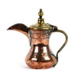 A Turkish / Islamic tinned copper and brass dallah coffee pot, 21cms (8.75ins) high.