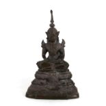 A Tibetan bronze figure seated in meditation, 29cms (11.5ins) high.