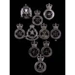 A collection of ten mainly British Police cap badges including: Kent Constabulary, Cumbria