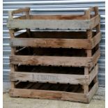 A group of five wooden apple crates.