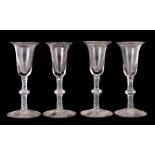 A set of four wine glasses with air twist knopped stem, 16cms (6.25ins) high (4).Condition Report