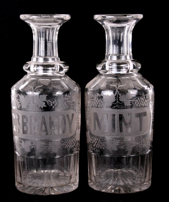 A pair of 19th century decanters with etched grape and vine decoration, Brandy and Mint, 27cms (10.