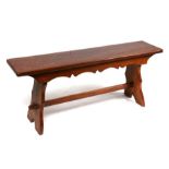 An Arts & Crafts oak bench, 107cms (42ins) wide.Condition Report General nicks, good overall