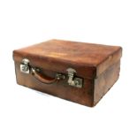 An early 20th century gentleman's leather suitcase, 70cms (27.5ins) wide.